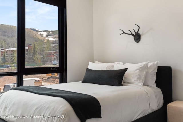 bedroom with a mountain view