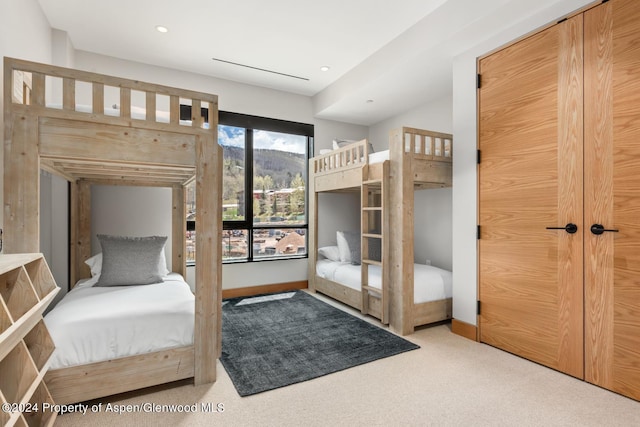 bedroom featuring light carpet