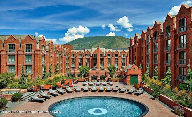 view of pool featuring a mountain view