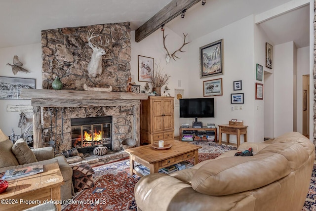 living room with a fireplace and lofted ceiling with beams