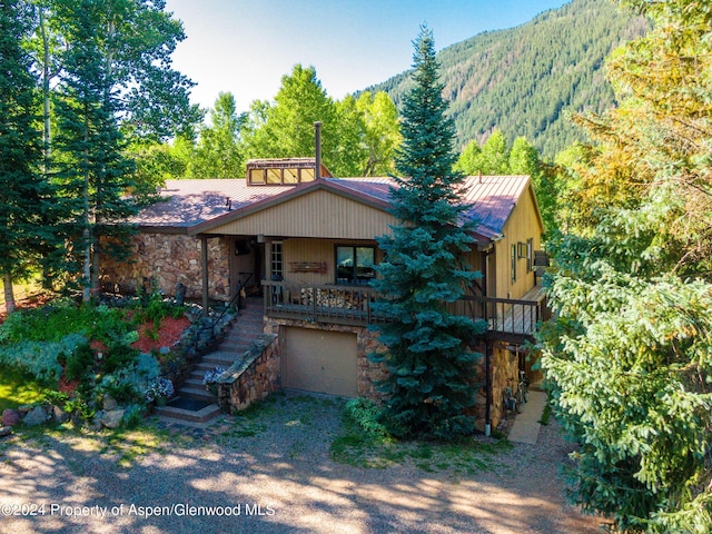 view of front of house featuring a mountain view and a garage