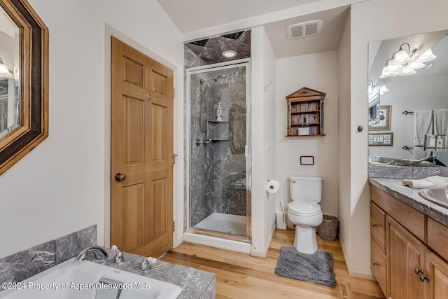 full bathroom with hardwood / wood-style floors, vanity, toilet, and shower with separate bathtub