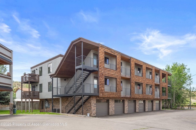 1472 W Main St, Carbondale, CO 81623 - view of property with driveway, stairs, and a garage