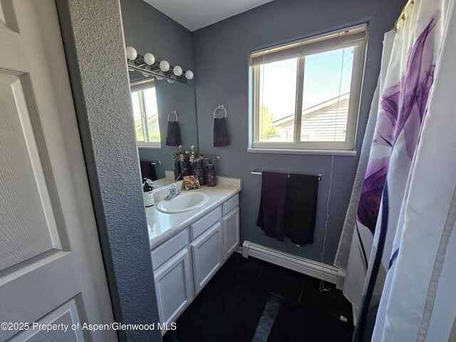 1650 Dogwood Dr, Rifle, CO 81650 - full bath featuring vanity, tile patterned floors, and baseboards