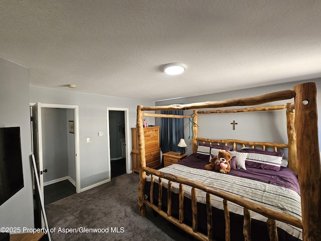 1650 Dogwood Dr, Rifle, CO 81650 - carpeted bedroom featuring a textured ceiling and baseboards