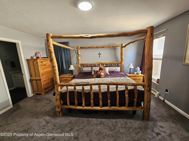 1650 Dogwood Dr, Rifle, CO 81650 - bedroom featuring carpet flooring, a baseboard radiator, and a textured ceiling