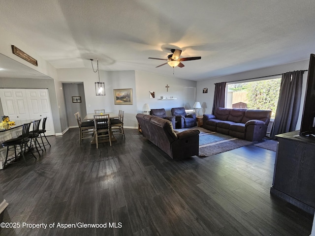 1650 Dogwood Dr, Rifle, CO 81650 - living area with a ceiling fan, dark wood-style flooring, a textured ceiling, and baseboards