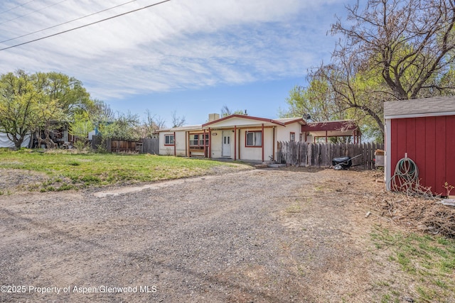 265 SW 11th Ave, Cedaredge, CO 81413 - manufactured / mobile home featuring an outbuilding and a chimney