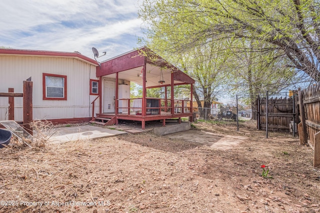 265 SW 11th Ave, Cedaredge, CO 81413 - back of property featuring a fenced backyard and a deck