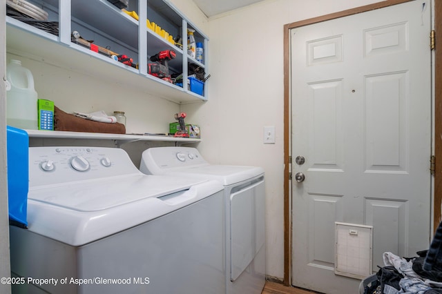265 SW 11th Ave, Cedaredge, CO 81413 - washroom with washer and clothes dryer and wood finished floors