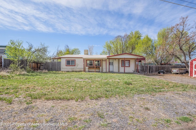 265 SW 11th Ave, Cedaredge, CO 81413 - view of front of house with a chimney and metal roof