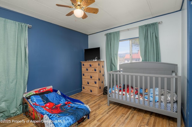 265 SW 11th Ave, Cedaredge, CO 81413 - bedroom featuring wood finished floors and a ceiling fan