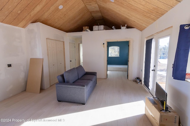 living area with light hardwood / wood-style flooring, high vaulted ceiling, and wood ceiling