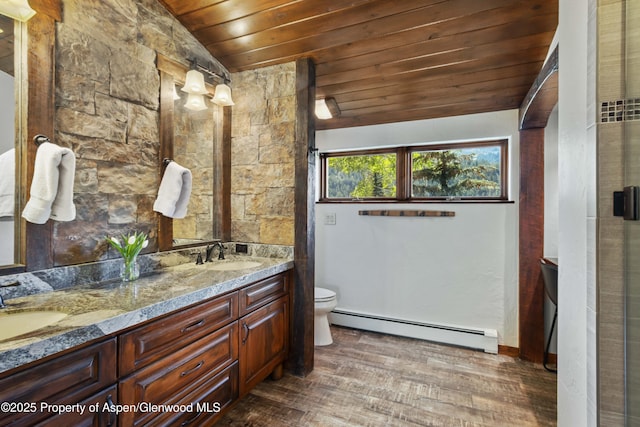 425 Crystal Park Dr, Redstone, CO 81623 - full bathroom featuring a baseboard heating unit, wood ceiling, double vanity, wood finished floors, and lofted ceiling