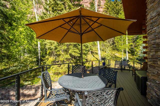 425 Crystal Park Dr, Redstone, CO 81623 - deck featuring outdoor dining area and view of scattered trees
