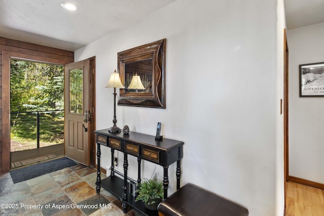425 Crystal Park Dr, Redstone, CO 81623 - entrance foyer with baseboards and stone finish flooring
