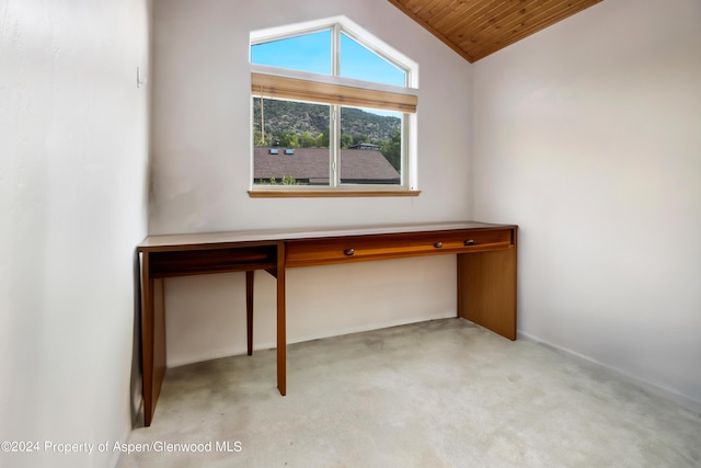 unfurnished office featuring wood ceiling and lofted ceiling