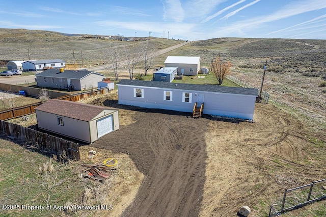 birds eye view of property featuring a mountain view