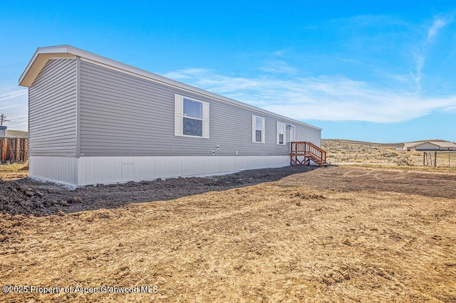 view of side of property with fence