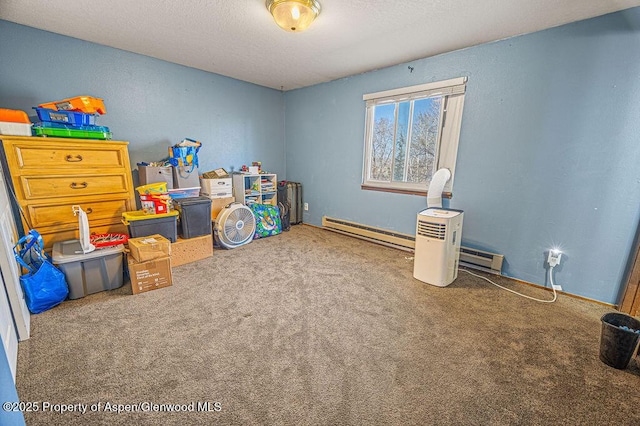 rec room featuring carpet, baseboard heating, and a textured ceiling