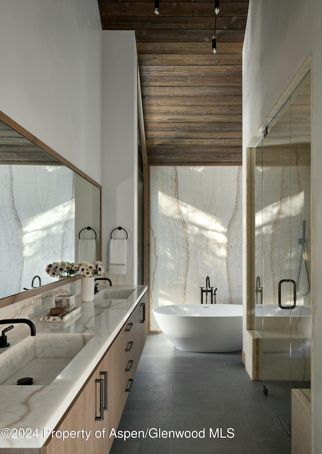 bathroom featuring vanity, plus walk in shower, and a high ceiling