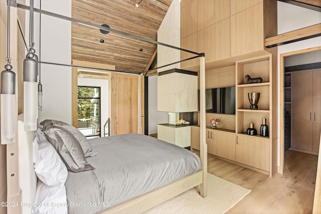 bedroom featuring lofted ceiling, wood ceiling, and light hardwood / wood-style flooring