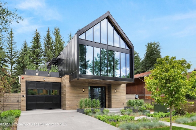 411 Pearl Ct, Aspen, CO 81611 - modern home with concrete driveway
