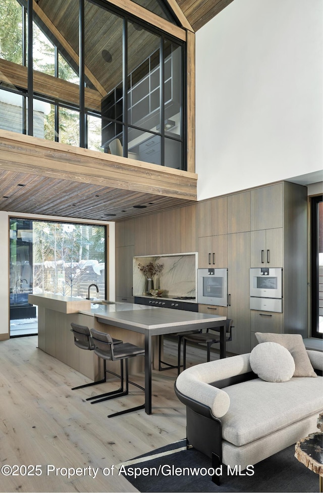 411 Pearl Ct, Aspen, CO 81611 - dining area with high vaulted ceiling, light wood finished floors, and wood ceiling