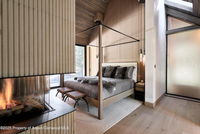 411 Pearl Ct, Aspen, CO 81611 - bedroom featuring high vaulted ceiling and light wood-style floors