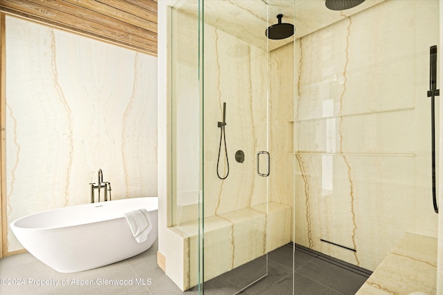 bathroom with plus walk in shower and tile patterned flooring