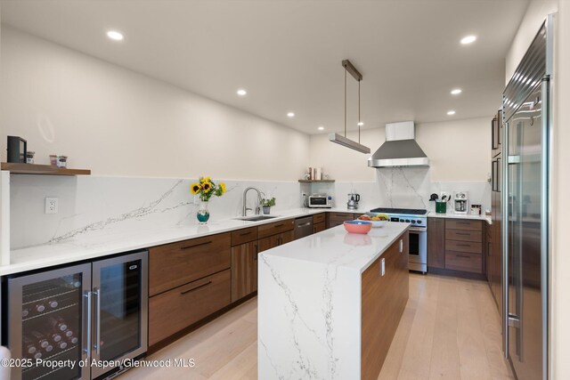 2240 Old Herron Rd, Basalt, CO 81621 - kitchen featuring wall chimney exhaust hood, beverage cooler, high end appliances, modern cabinets, and recessed lighting