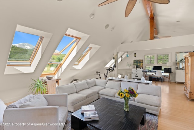 2240 Old Herron Rd, Basalt, CO 81621 - living room with a skylight, high vaulted ceiling, light wood finished floors, beamed ceiling, and a ceiling fan
