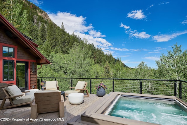 1271 Ute Ave, Aspen, CO 81611 - deck with a wooded view and an outdoor hot tub