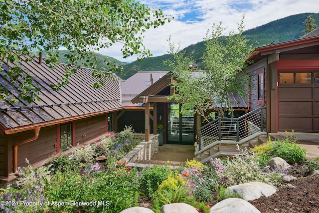 1271 Ute Ave, Aspen, CO 81611 - doorway to property featuring a mountain view, a metal roof, and a standing seam roof