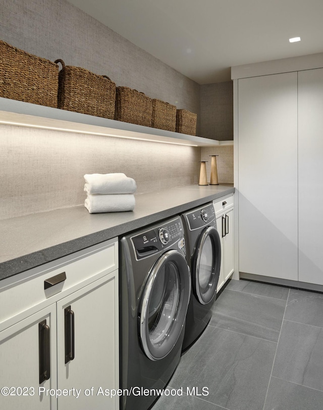 1271 Ute Ave, Aspen, CO 81611 - laundry area with washer and clothes dryer, cabinet space, and tile patterned flooring