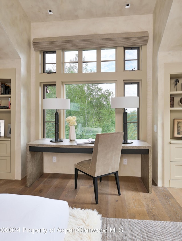 1271 Ute Ave, Aspen, CO 81611 - dining space featuring wood finished floors and built in shelves