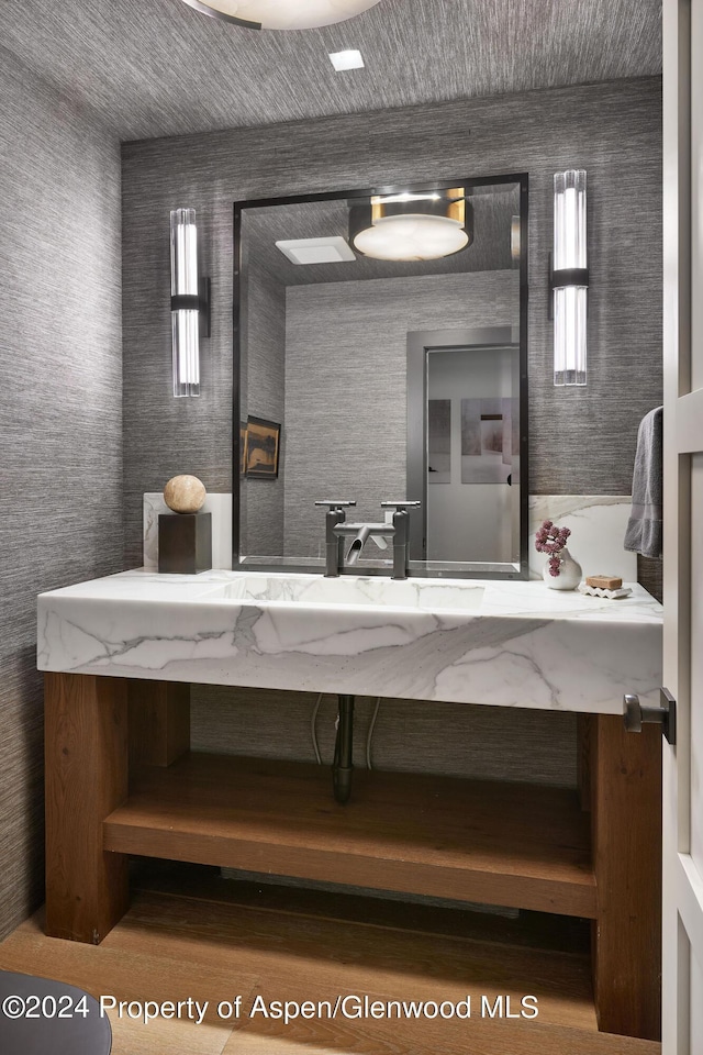 1271 Ute Ave, Aspen, CO 81611 - bathroom featuring plenty of natural light, vanity, and wallpapered walls