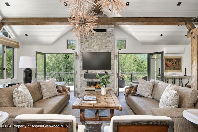 1271 Ute Ave, Aspen, CO 81611 - living room featuring a wall unit AC and a stone fireplace