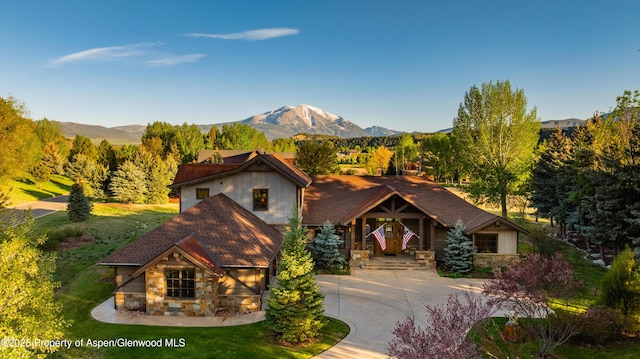 255 Snowcap Cir, Carbondale, CO 81623 - view of front of home with stone siding and a mountain view