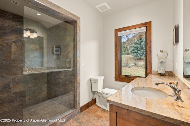 255 Snowcap Cir, Carbondale, CO 81623 - full bath featuring a tile shower, toilet, baseboards, and vanity