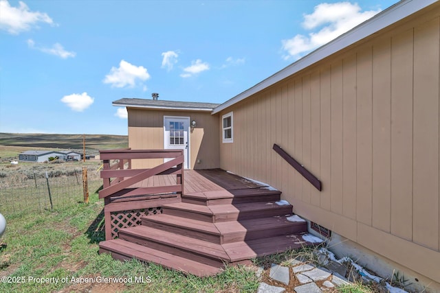 exterior space featuring stairway and fence