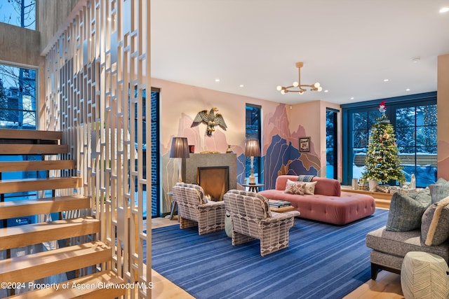 carpeted living room featuring a chandelier