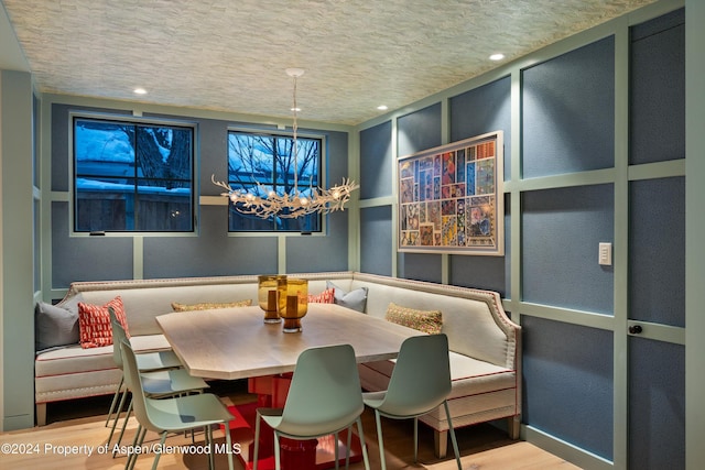 dining space featuring breakfast area and wood-type flooring