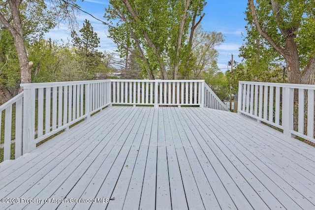 885 Stout St, Craig, CO 81625 - wooden terrace featuring view of wooded area