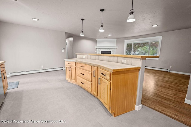 885 Stout St, Craig, CO 81625 - kitchen with a baseboard radiator, a fireplace, baseboards, tile counters, and recessed lighting