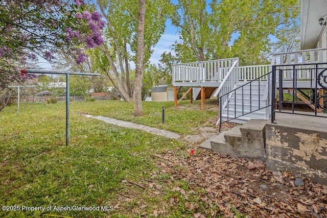 885 Stout St, Craig, CO 81625 - view of grassy yard with stairway and a wooden deck