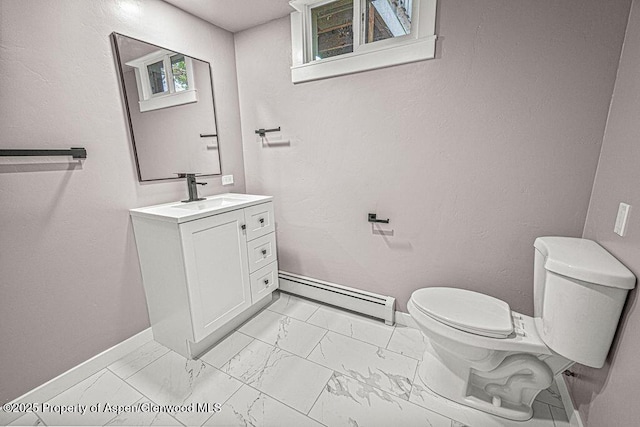 885 Stout St, Craig, CO 81625 - half bath featuring baseboard heating, baseboards, marble finish floors, toilet, and vanity