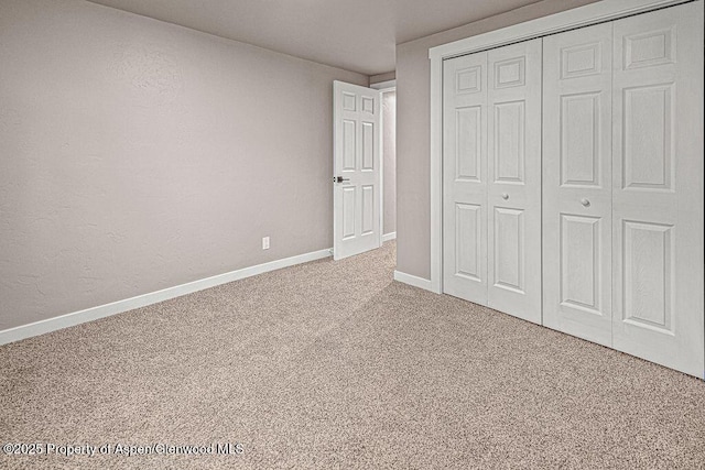 885 Stout St, Craig, CO 81625 - unfurnished bedroom featuring carpet floors, a closet, and baseboards