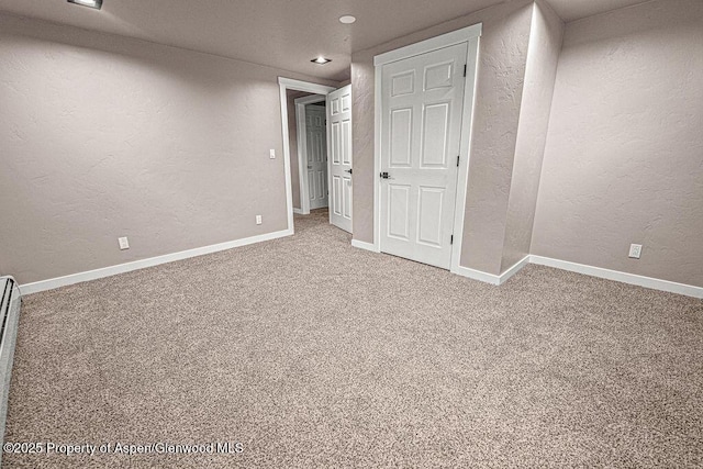 885 Stout St, Craig, CO 81625 - empty room featuring a textured wall, light carpet, baseboards, and recessed lighting