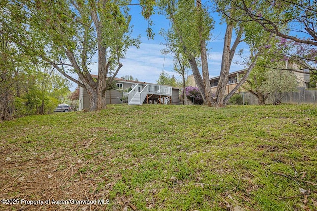 885 Stout St, Craig, CO 81625 - view of green lawn featuring stairway and a wooden deck